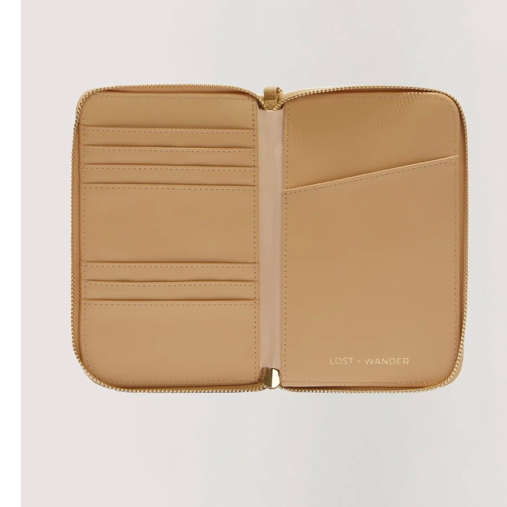 NWOT Lost and Wander Worryfree Passport Wallet in tan. Wristlet strap.